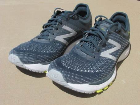 A pair of black and white sneakers

Description automatically generated with low confidence