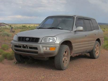 A car on a dirt road

Description automatically generated with medium confidence