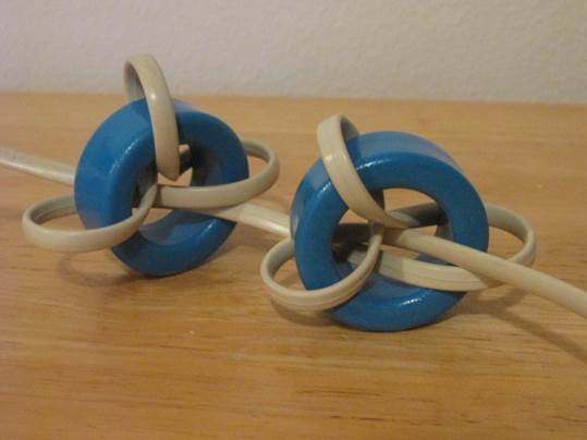 A pair of blue and white headphones on a wooden surface

Description automatically generated with low confidence